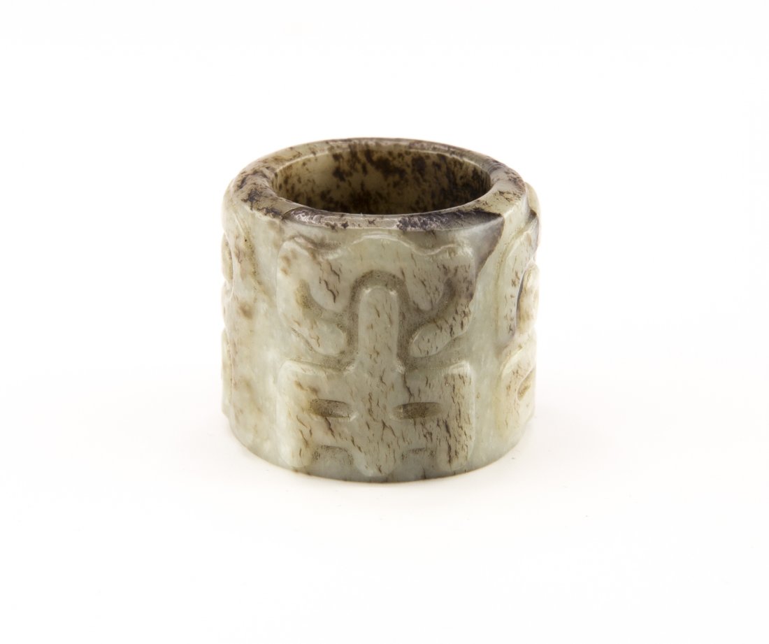 Chinese Jade Archer's Ring: Depicting emblem of archaistic animal on exterior wall, dated as Han dynasty, ht. 1, diam. 1 1/4 in.