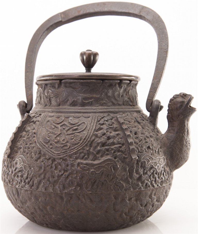 JAPANESE IRON TEAPOT: Japanese Iron Teapot with Raised Design Overall Than Spout. Ht. 8 1/2 in.