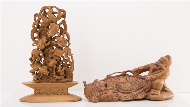 TWO CHINESE SOAPSTONE CARVINGS: Two Chinese Soapstone Carvings, One (1) Fisherman with basket of Fish. and some Koi among the seed. Lg. 6 in. Ht. 4 in.