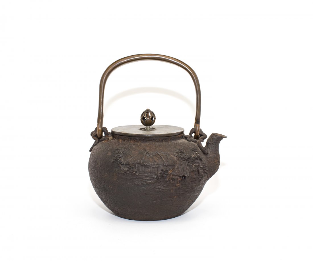 A JAPANESE IRON TETSUBIN: Japanese Iron Tetsubin. Overall ht. 8 3/4 in.
