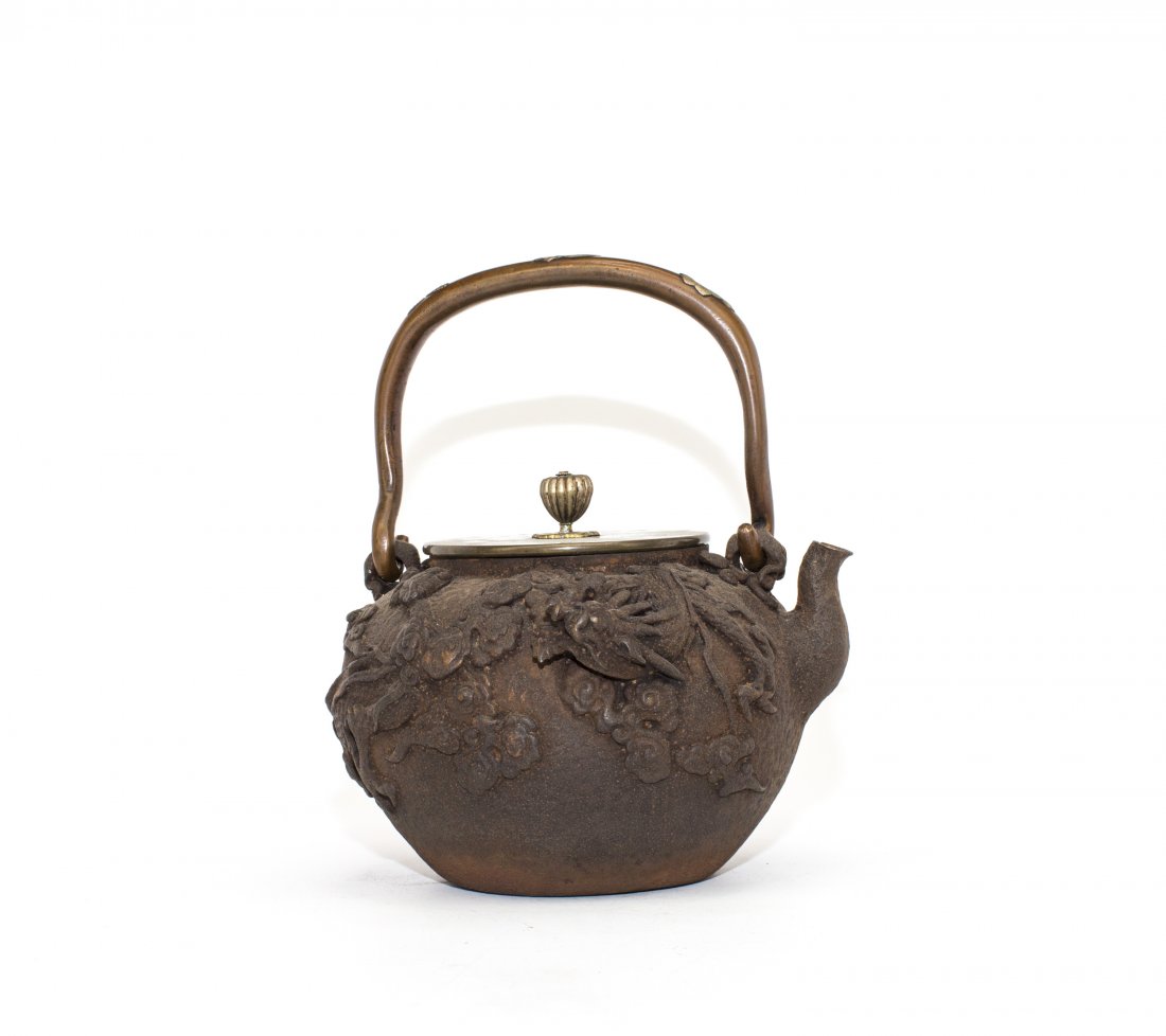 A JAPANESE IRON TETSUBIN: Japanese Iron TeTsubin. Overall ht. 8 3/4 in.