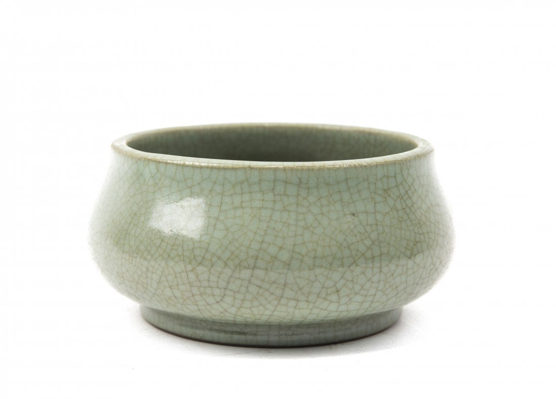 A CELADON-GLAZED BRUSH WASHER: Chinese Celadon Glazed Brush Washer. ht. 3, diam. 5 1/2 in.