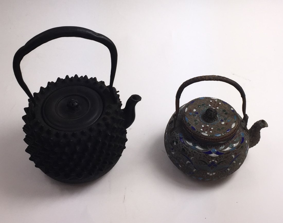 ONE JAPANESE IRON TEAPOT AND ONE CHINESE TEAPOT: One Japanese Iron Teapot and One Chinese Enamel Blue Decrotated Teapot. Ht. 8 in.