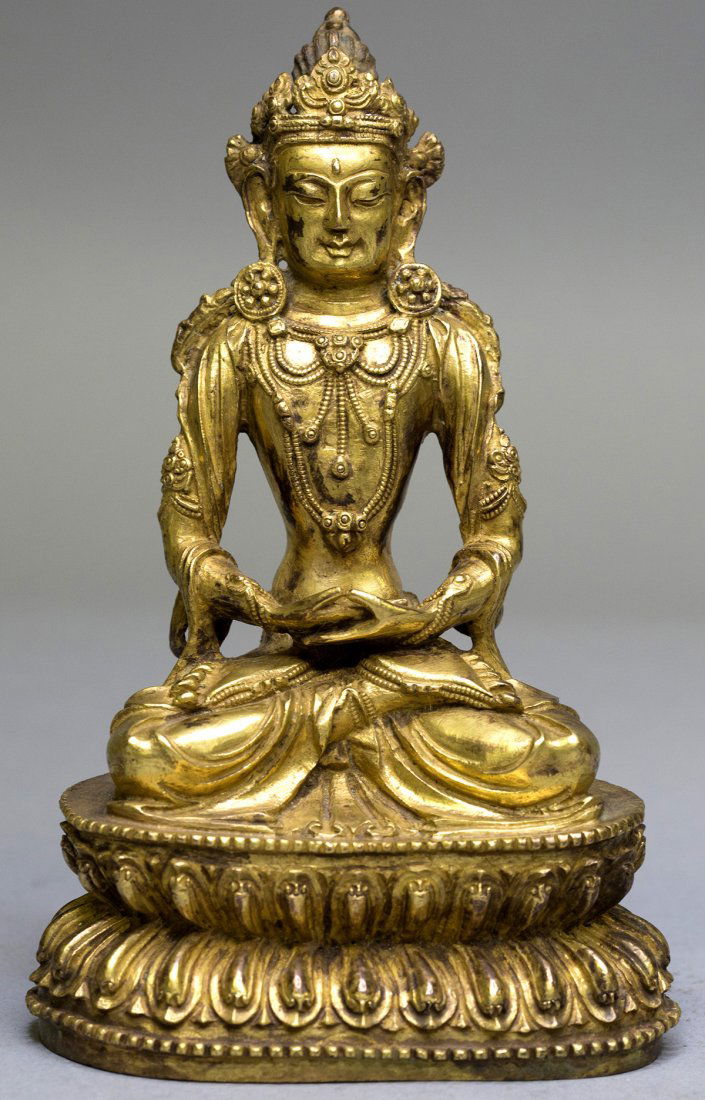 A GILT-BRONZE FIGURE OF BUDDHA (1 of 5)