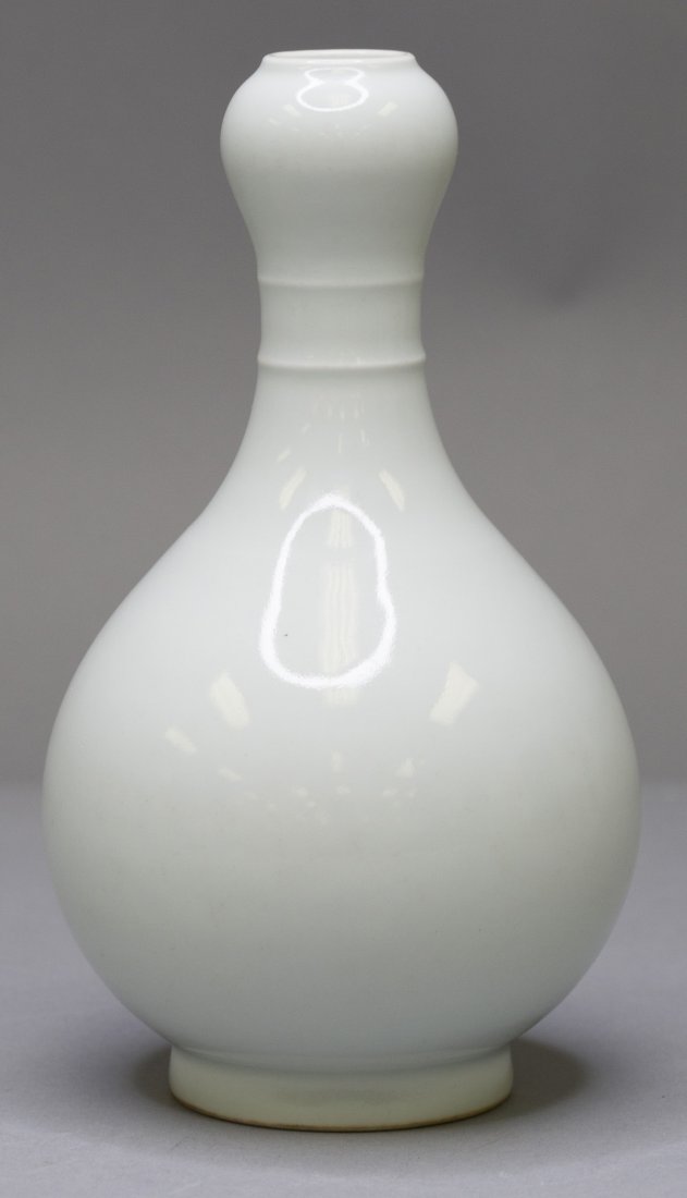 A WHITE GLAZED GALLIC HEAD SHAPED VASE (1 of 4)