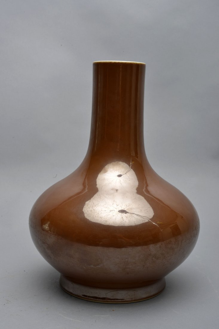 A BROWN GLAZED VASE (1 of 3)