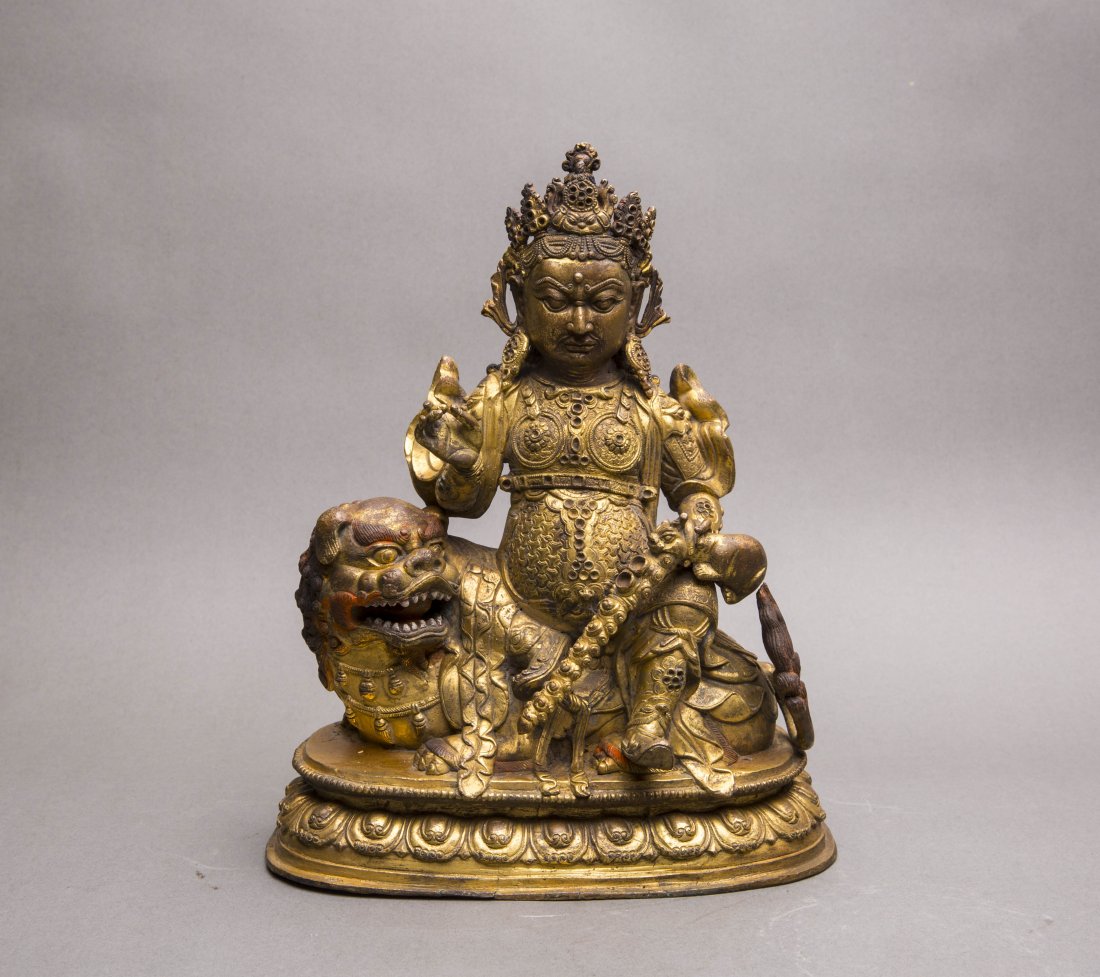 A GILT-BRONZE FIGURE OF JAMBHALA (1 of 4)