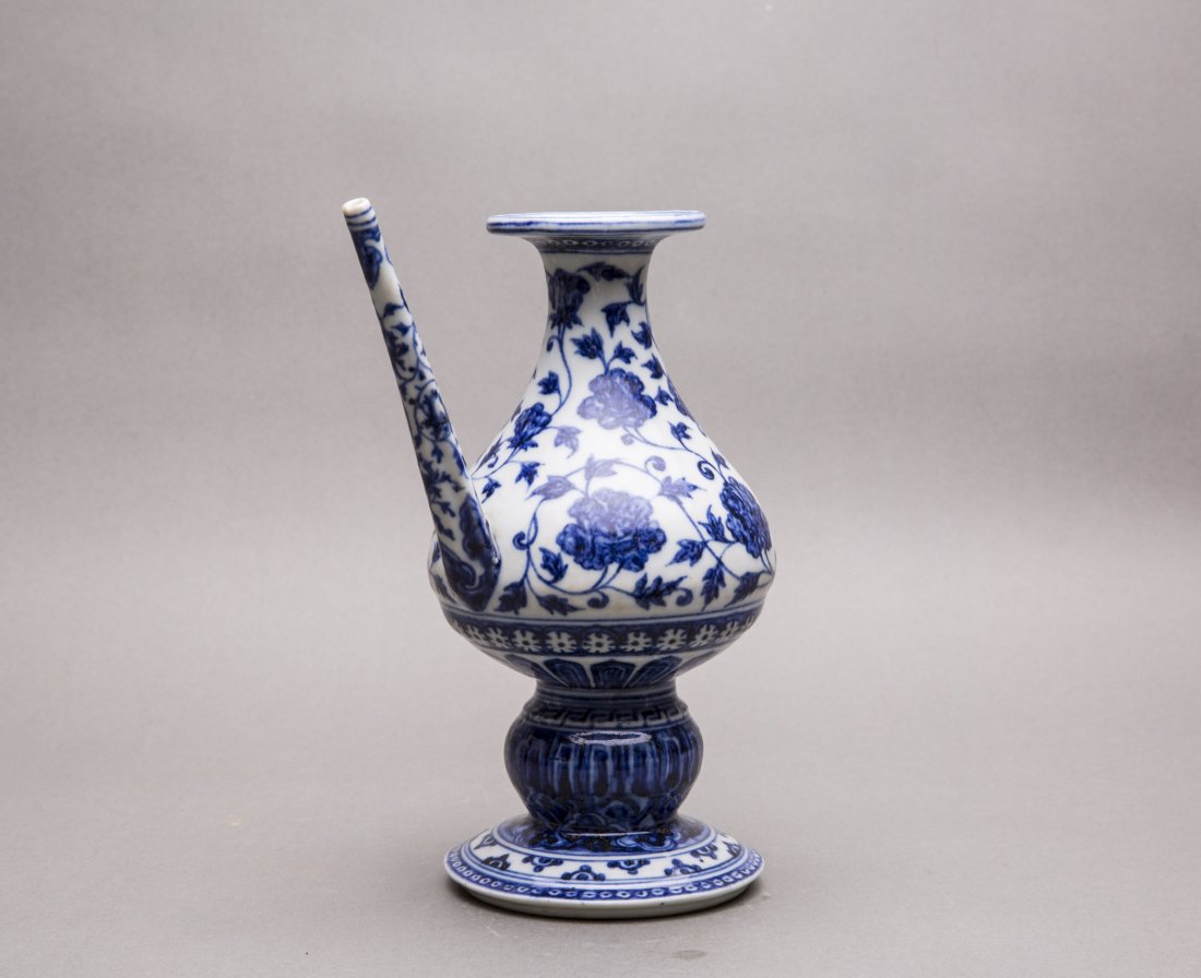 A BLUE AND WHITE HOLY-WATER VASE (1 of 5)