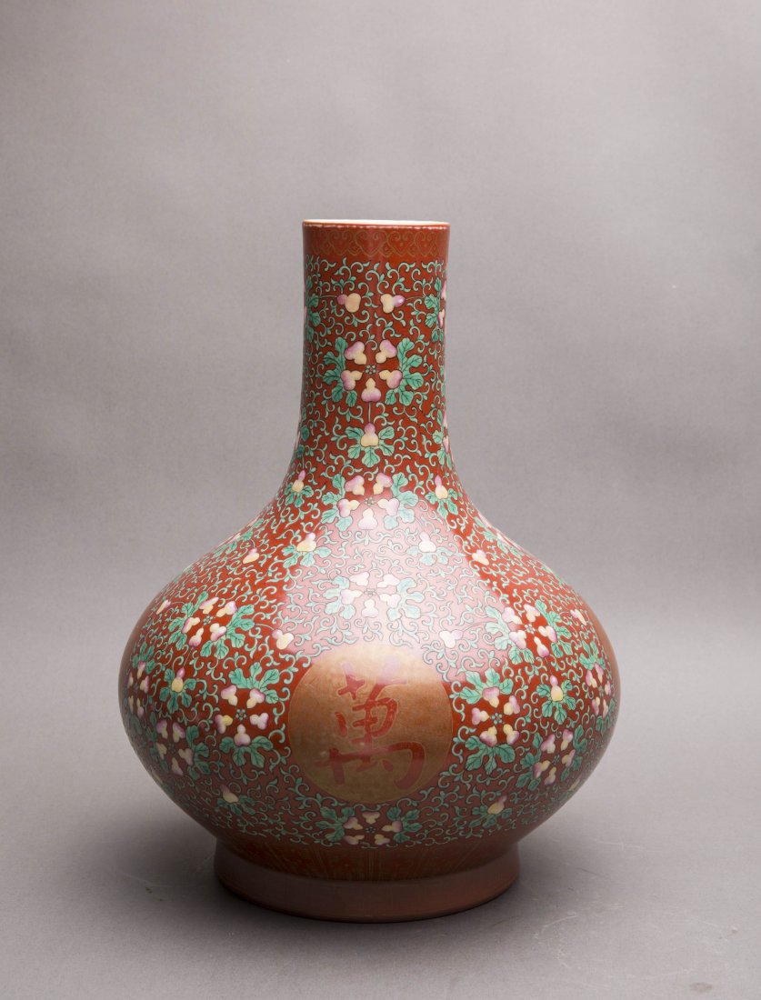 AN IRON-RED GROUND FAMILLE-ROSE BOTTLE VASE (1 of 6)
