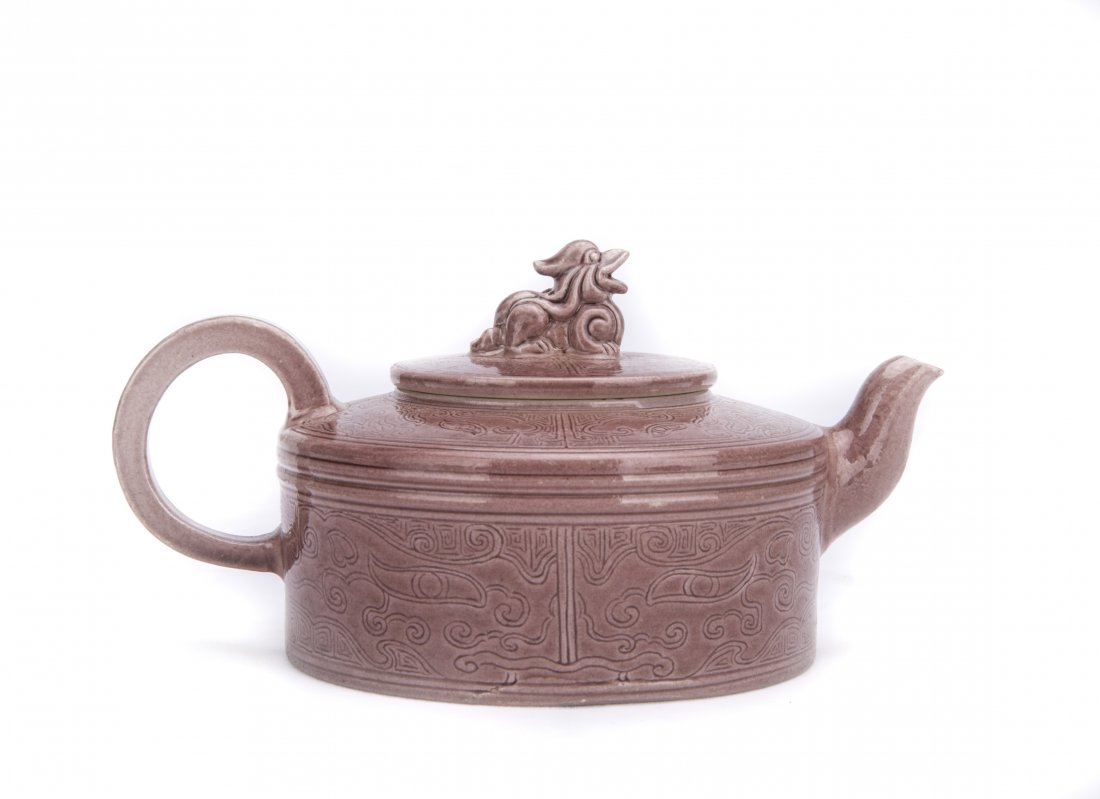 AN IRON-RED GLAZED TEAPOT (1 of 5)