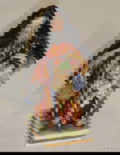 Rudolstadt porcelain figure. The male figure dresse: Rudolstadt porcelain figure. The male figure dressed in 19th century costume holding a chicken and a basket of eggs and a pitcher.