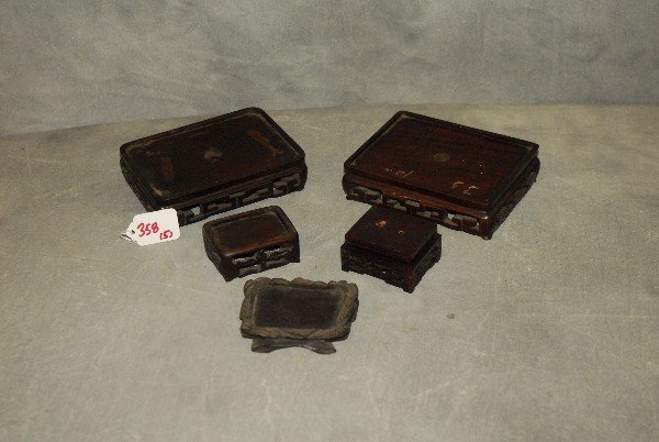 Five antique Chinese carved hardwood stands. Largest: (1 of 1)