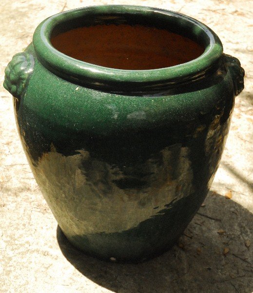 Large green glazed terracotta planter. H: 24" D: 24" (1 of 2)