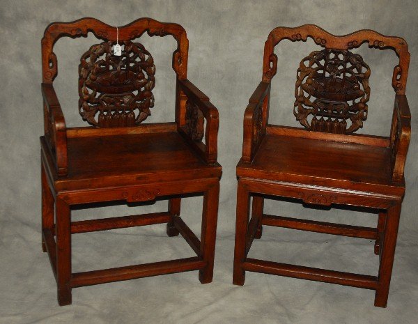 Chinese Ming dynasty style carved hardwood arm chairs .: Chinese Ming dynasty style carved hardwood arm chairs . H: 39" W: 24.25" D: 18"