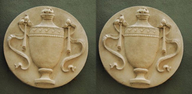 Pair of cast stone neoclassical style urn form roundel (1 of 2)