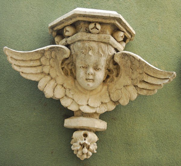 Cast stone angelic bracket. H: 27" W: 32" D: 11": Cast stone angelic bracket. H: 27" W: 32" D: 11"