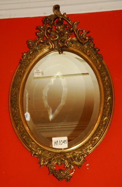 Rococo style carved gilt oval mirror. H: 37" W: 22" (1 of 3)