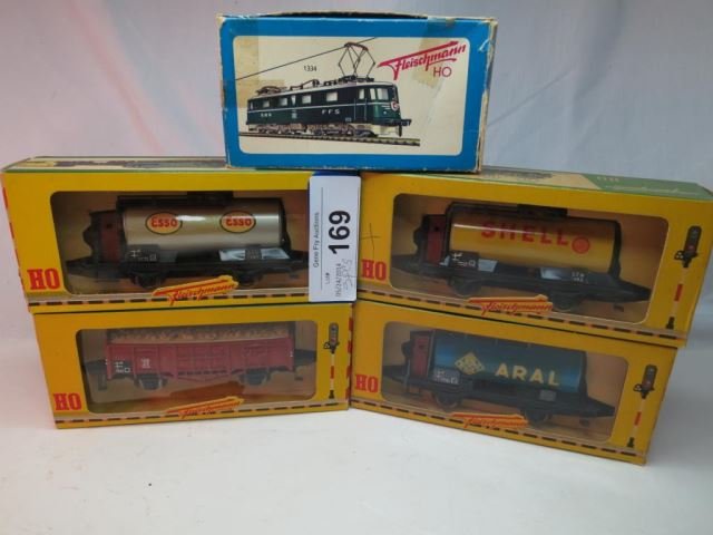 Four HO Fleischmann Train Cars in Original Boxes: - 1465 Esso Tank Car, 1455 Gondola Coal Car, 1465 Shell Tank Car, 1465 BV Aral Tank Car, and a Fleischmann 1x1771 Signal in Box.
