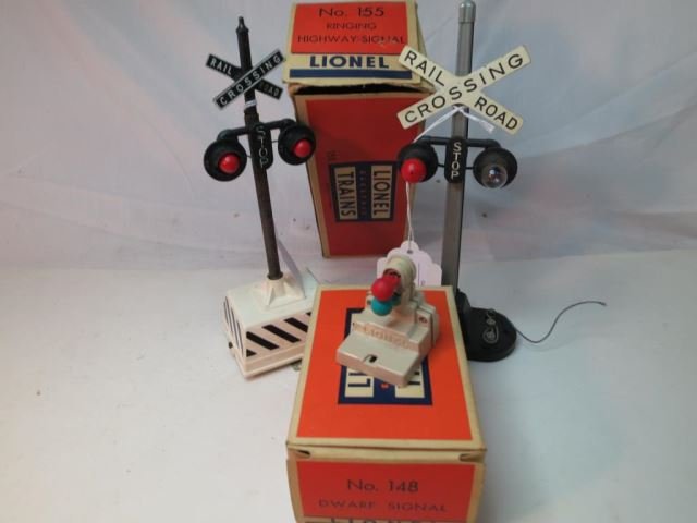 Three Lionel Train Signals - No. 155 Ringing: Highway Signal with Original Box, No. 148 Dwarf Signal with Original Box, and Highway Signal without Box.