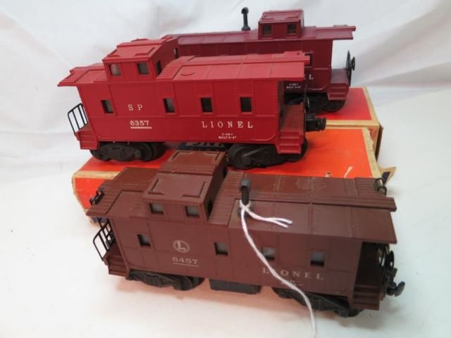 Three Lionel Cabooses - Two 6357 Red with: Original Boxes and a 6457 Brown w/o box.