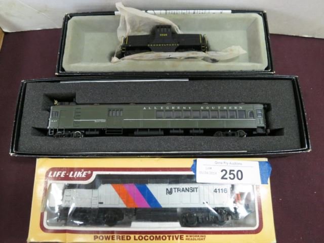Three Ho Scale Trains - Life Like Powered Loco: No. 8267, Bachmann Spectrum No. 81402, and Bachmann Spectrum No. 9348 GE 44 Ton Switcher all in boxes.