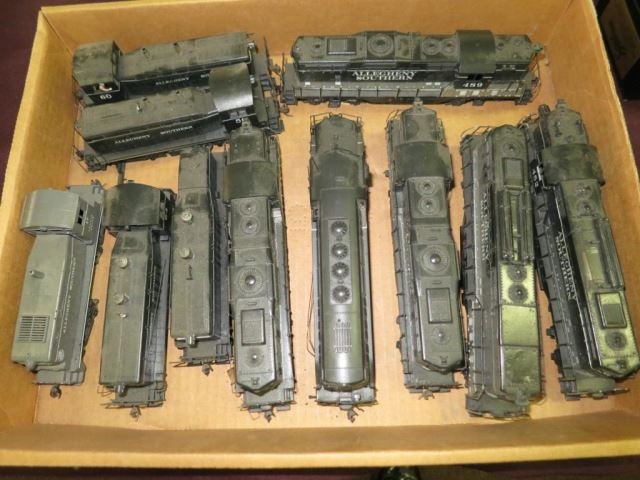 Group Lot of HO Scale Engines and Switchers (11: Pieces) Some Shells aren't attached and missing small pieces on some.