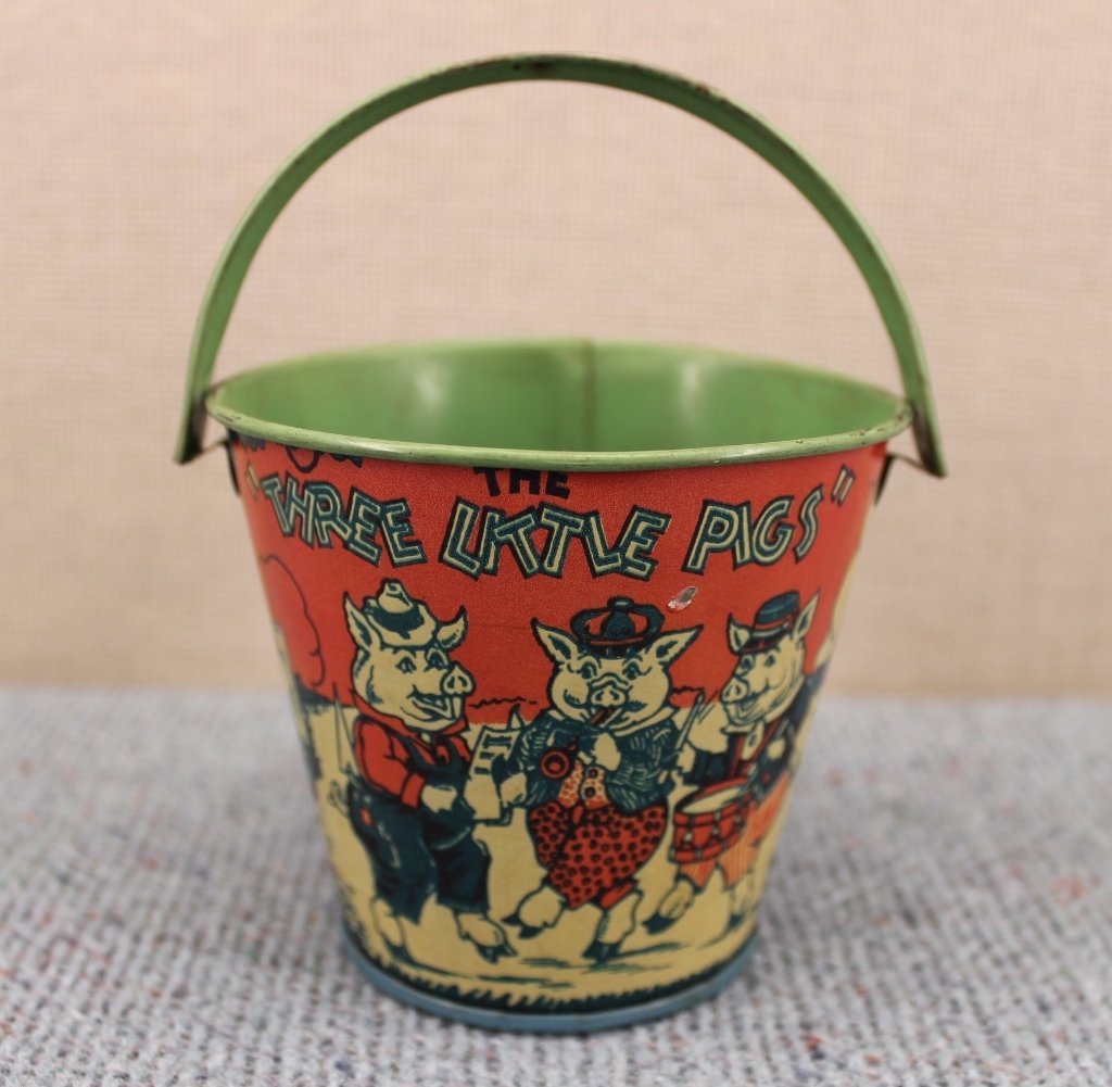 Chein Tin Butterfly & Three Little Pigs Sand Pail: Made by J. Chein & Co. Early tin "Three Little Pigs" sand pail is 5 inches tall from base to top of handle. The butterfly push toy is 26 inches long from the bottom of the tin butterfly to the top of 
