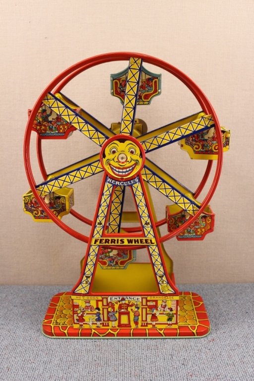 1930's J. Chein Hercules Ferris Wheel Tin Toy: Hercules Mechanical Ferris Wheel made by Chein & Co. Lithographed tin with spring driven motor. 16 1/2 inches tall. Wind up does work but seems a little tight. The toy is characterized by its brillian