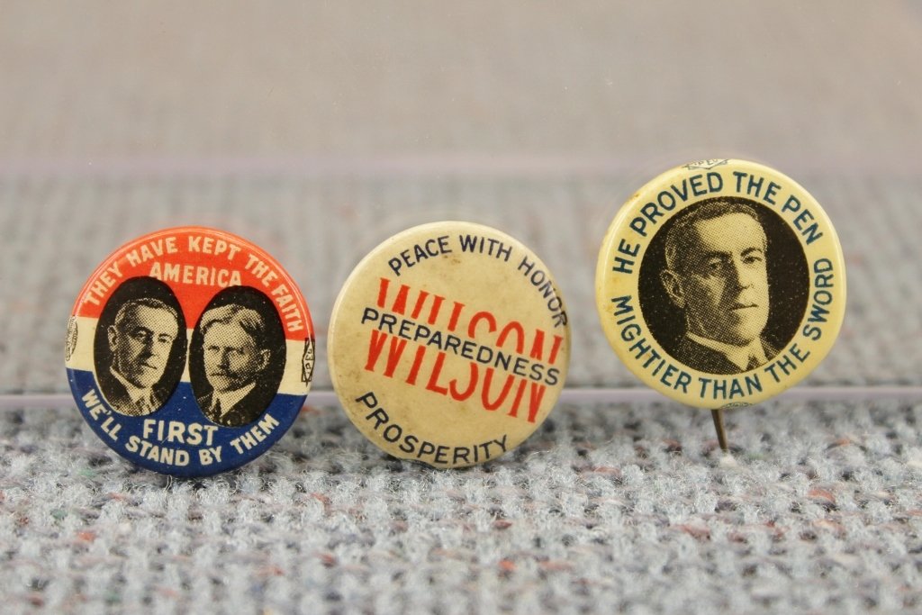Three Woodrow Wilson Political Buttons Ehrman: 1. ' Peace With Honor Preparedness Prosperity Wilson'. Paper backing is marked Ehrman. 7/8 inch. 2. 'He Proved The Pen Mightier Than The Sword'. Paper backing is marked Ehrman. 7/8 inch. 3. 'They Have