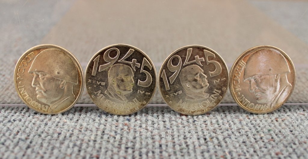World Coin Lot Mussolini - Hitler 25 Pieces: Some of these are fantasy/reproductions. Please see photos. 1. Four Mussolini 1943 20 L coins. 2. Two Mussolini 1945 20 L coins. 3. Two gold colored Vittorio Emanuele 100 Lire coins 4. One gold colore