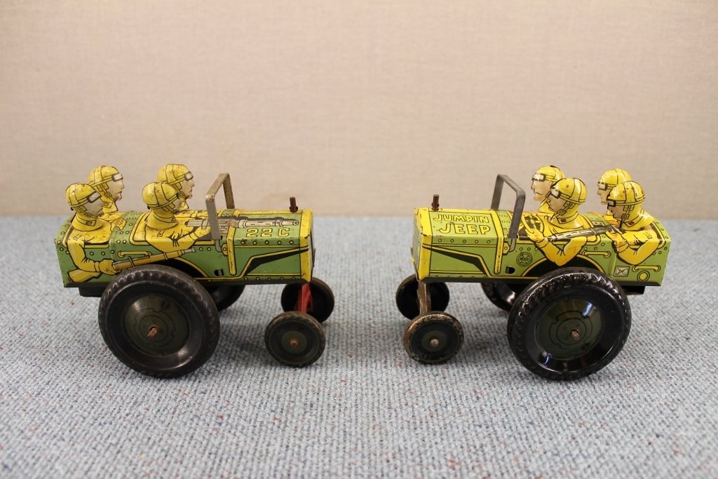 Two 1940's Marx Tin Jumpin Jeep Wind Up Toys: Tin Litho. Wind up works but is a little rough on one. 6 inches long.