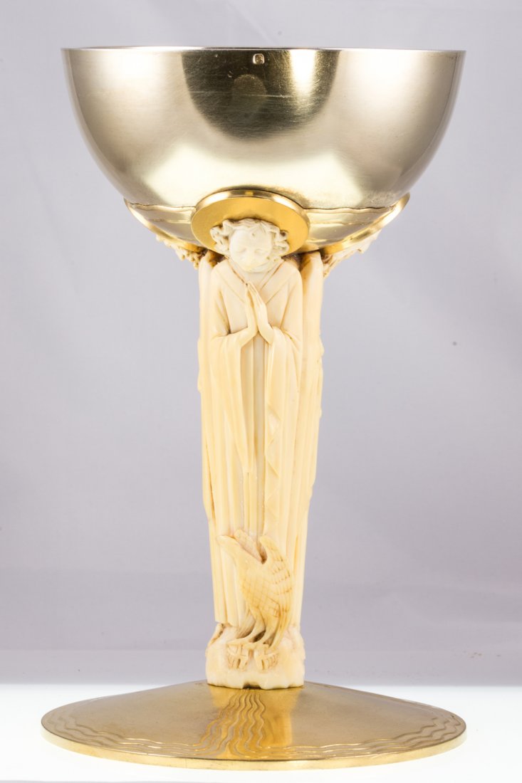 AN ART DECO FRENCH IVORY AND SILVER GILT CHALICE: AN ART DECO FRENCH IVORY AND SILVER GILT CHALICE - the carved ivory stem representing the apostles Peter, John and Paul, base stamped to the bottom with maker’s mark “V.F.”, with phrase