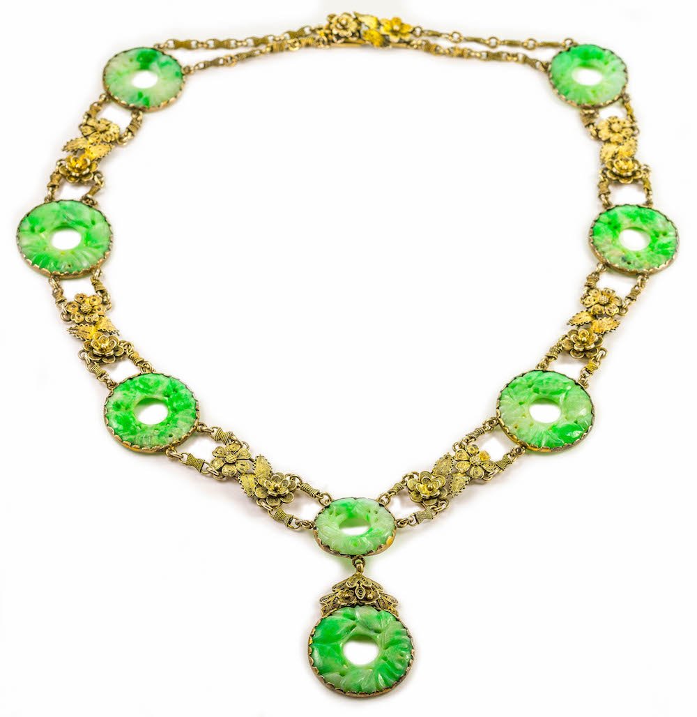 A CARVED JADEITE AND SILVER NECKLACE (1 of 3)