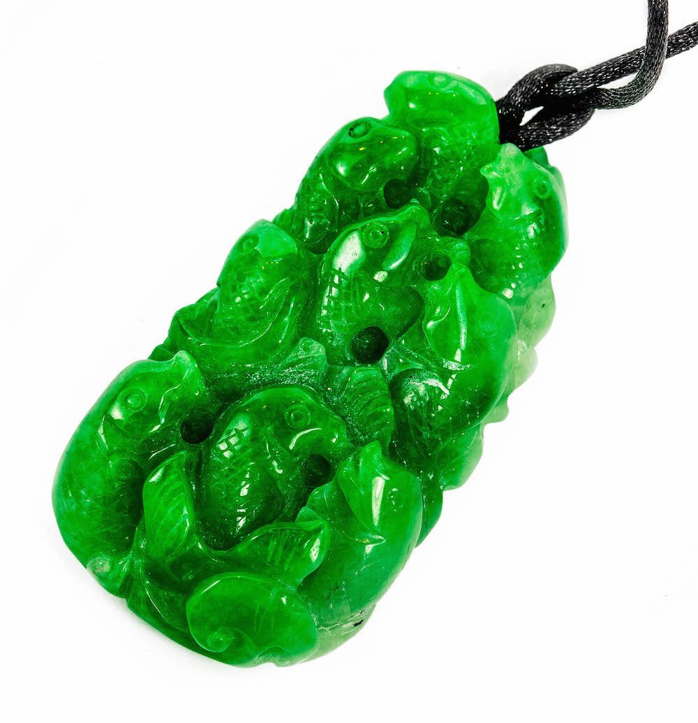A LARGE CARVED JADEITE PENDANT (1 of 2)