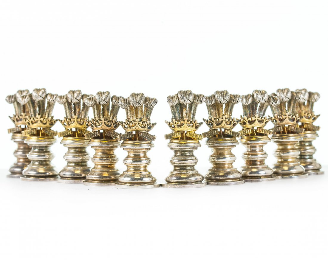 A SET OF GARRARD SILVER TABLE PLACEHOLDERS (1 of 4)