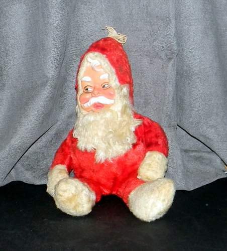 Vintage 1950's Stuffed Santa Claus: Straw stuffed. Made of red and white plush and rubber or vinyl face with lots of detail. Plush beard, mittens and boots. He measures approximately 17" tall. No tag.