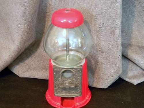 Vintage 1985 Carousel Gumball Dispenser: This is a small, vintage gumball dispenser made by Carousel in 1985. It would be a nice addition to a collection or store front. It measures 11", no box.