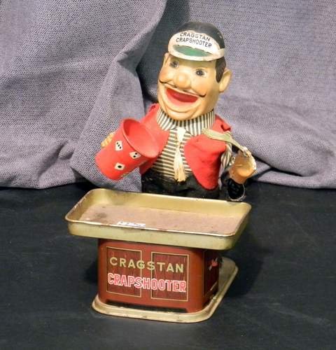 Vintage 60's Yonezawa Battery-Op Cragstan Crapshooter: This is a Vintage 1960's Yonezowa Cragstan Battery Operated Tin Litho Crapshooter. It measures about 9 & 1/2" tall. Makes a great display item.
