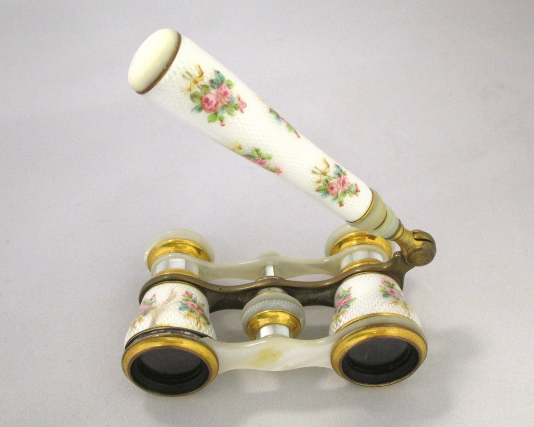 B. Altman Opera Glasses: These antique opera glasses feature a delicate floral design. There are some blemisses which can be seen in the photo.