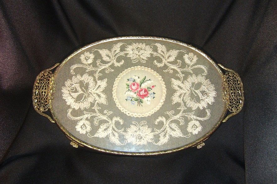 Vintage Gold Plated Tray: Bedroom/Bathroom vinatage gold plated footed tray with doily between two pieces of glass. This item is in good condition and ready for display. 15" L x 9" W