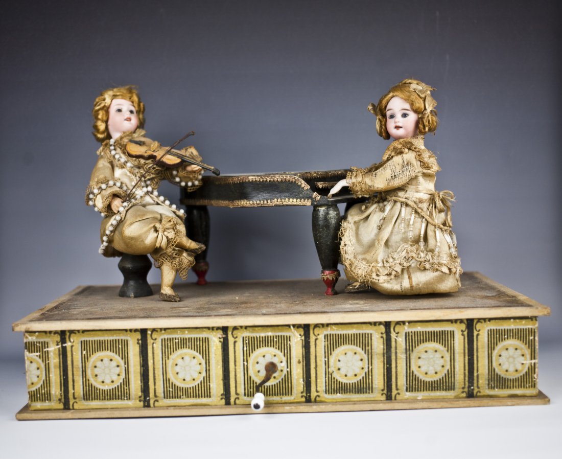 Musical automaton: 1800's musical automaton with two doll play music. the doll will play piano and other play and move her head .