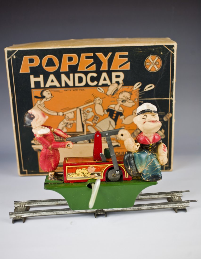 Tin Litho Marx Popeye Handcar Wind-Up Toy.: Description American. Working. Handcar comes with the usual melted rubber figures. The popeye hand is broken .Includes original boxCondition (Good). Size 6" L.