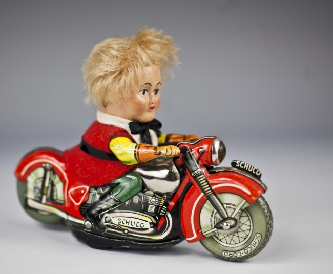 Schuco Mirako Peter Motorcycle No. 1013, c. 1955: Schuco Mirako Peter Motorcycle No. 1013, c. 1955 Made in Western Germany, lithographed tin, clockwork (working), length 5 1/10 in., very good condition.