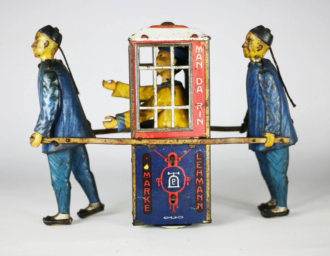 Lehmann Marke" Chinese Sedan Toy: "Lehmann Marke" Chinese Sedan Toy, Pat. Date 12 May 1903. This good tin toy has most all of its original paint depicting a sedan chair with figure being carried by 2 Chinese men, it operates with the 