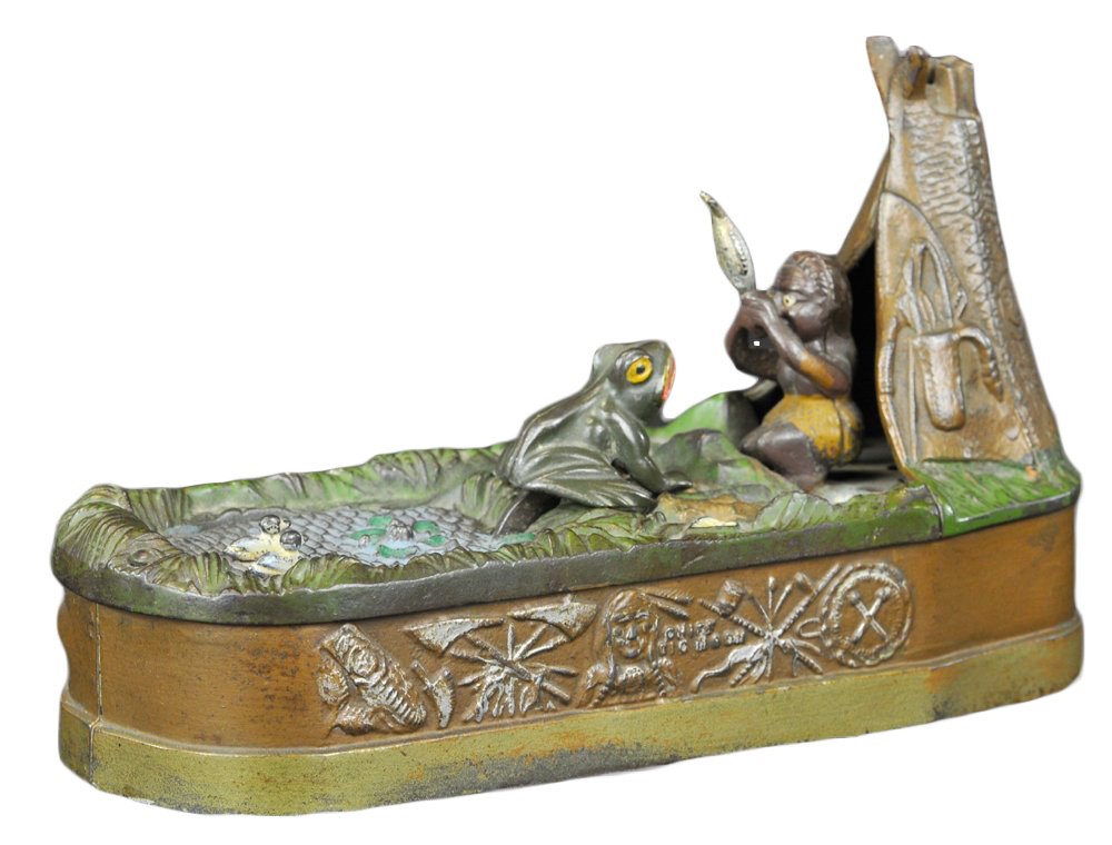 CHIEF BIG MOON MECHANICAL BANK: Brown base, J & E Stevens Co., designed by Charles A. Bailey, patented 8/8/1899. Place the coin in slot in front of pond, press the lever, and as the coin disappears the frog springs from the water af