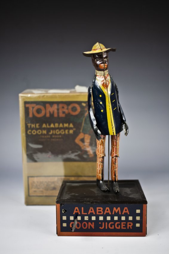 Alabama Coon Jigger: Germany, lithographed tin, classic dancing minstrel on base, colorful suited figure. 11" h.