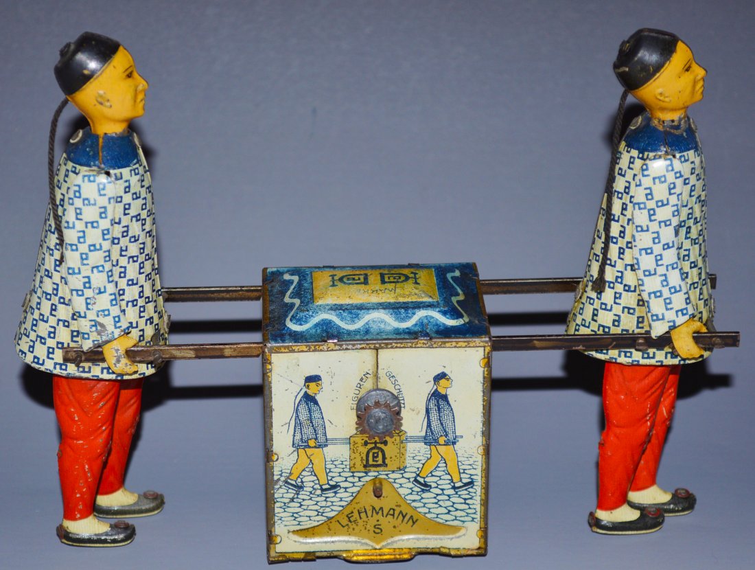 LEHMANN KADI: Germany lithographed tin, depicts two Chinese men carrying box of Peking Tea, flywheel driven, quite natural walking motions. 7 1/2'' long.