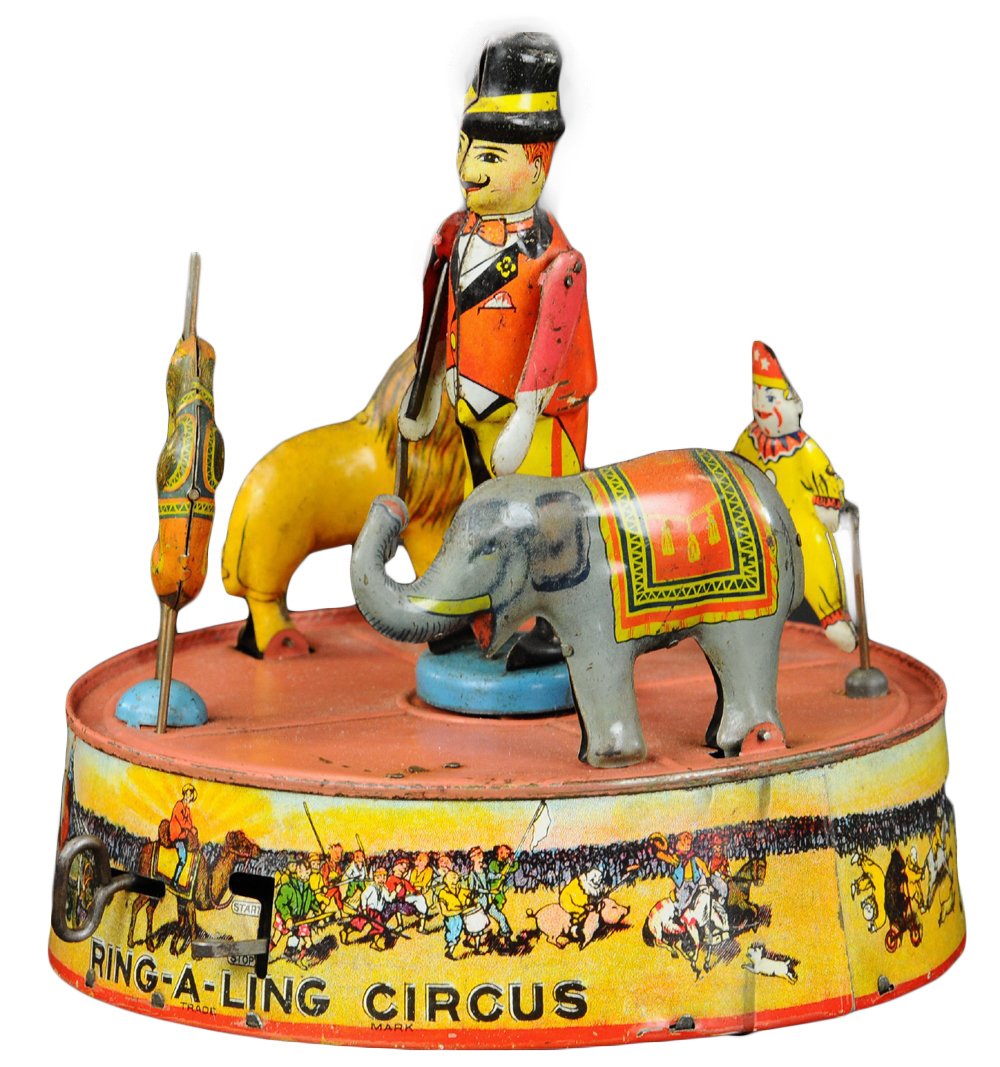 RING-A-LING CIRCUS: Louis Marx, lithographed tin, elaborate toy features circus animals together with trainer, all standing on base which is extensive clockwork action. 7 1/2" diam.
