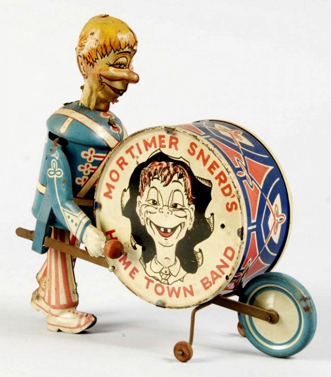 Tin Litho Marx Mortimer Snerd Home Town Band: Louis Marx, popular character walks with wheelbarrow style drum reading, "MORTIMER SNERD'S HOME TOWN BAND," with arm pounding repeatedly, done in eye-catching lithographed tin. 8 1/2" l.
