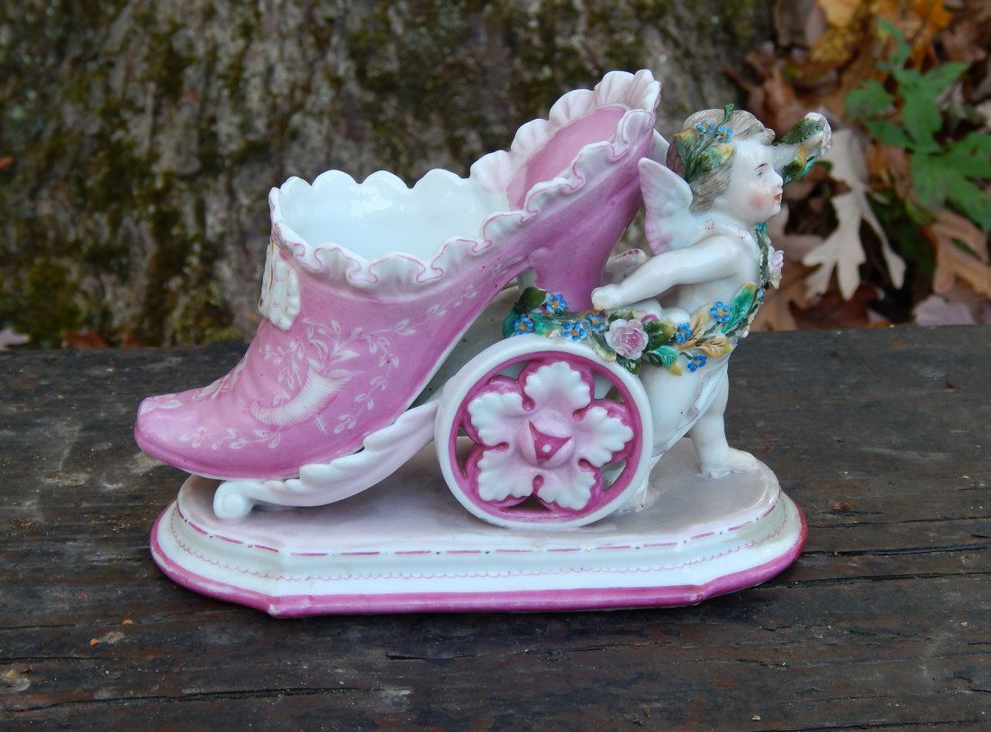 19th C Meissen KPM Winged Cherub Putti Shoe Cart With: 19th Century Meissen KPM Winged Cherub Putti Shoe Cart With Bird Spill Vase. Some slight damage to pedals & garland. Old repair on raised arm holding garland with old restorations to foot, applied flo